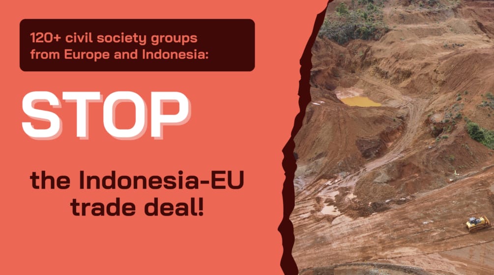 Manifesto con lo slogan “STOP the Indonesian-EU trade deal!